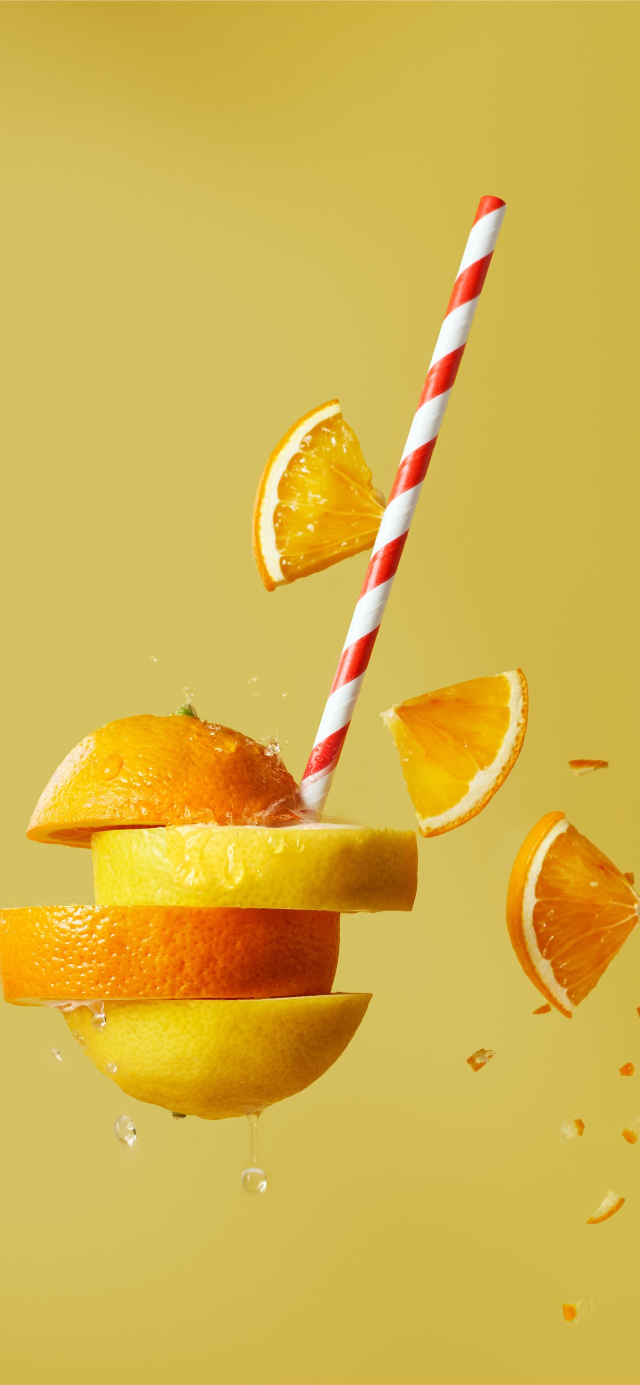 sliced orange fruit with straw iPhone Wallpaper Free Download