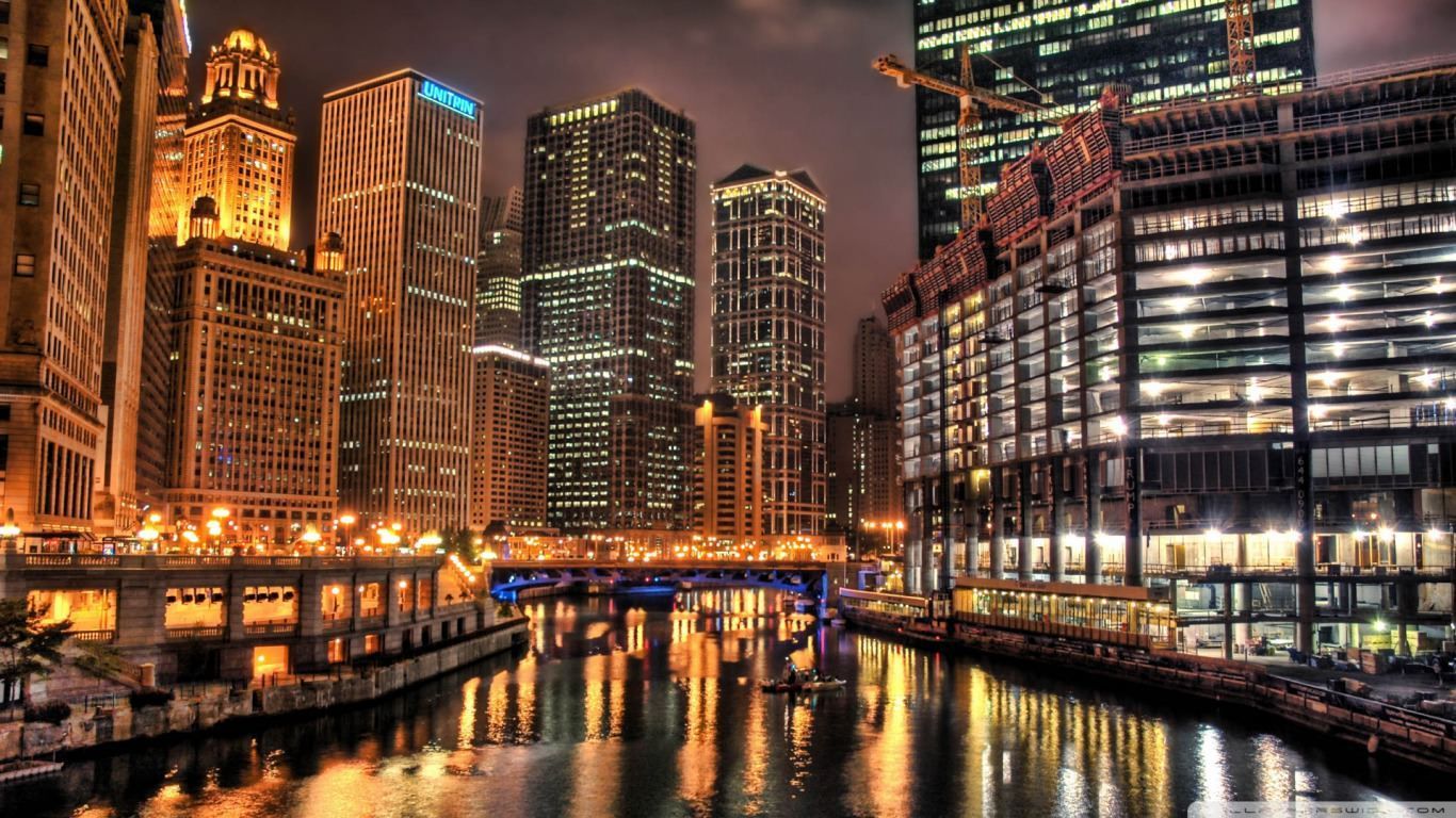 A city with many tall buildings and water - Chicago