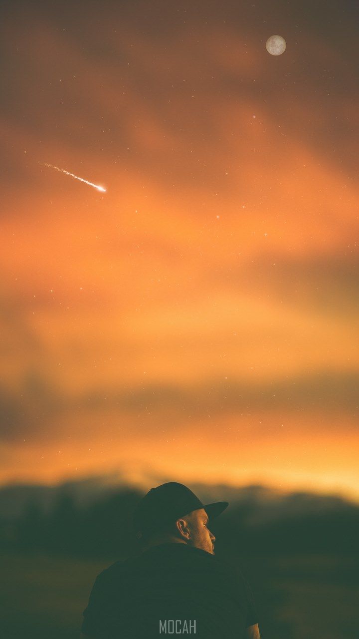 man sits beneath an orange sky where a meteor streaks and a full moon rises, man moon meteor at dusk, Samsung Galaxy A5 background hd, 720x1280 Gallery HD Wallpaper