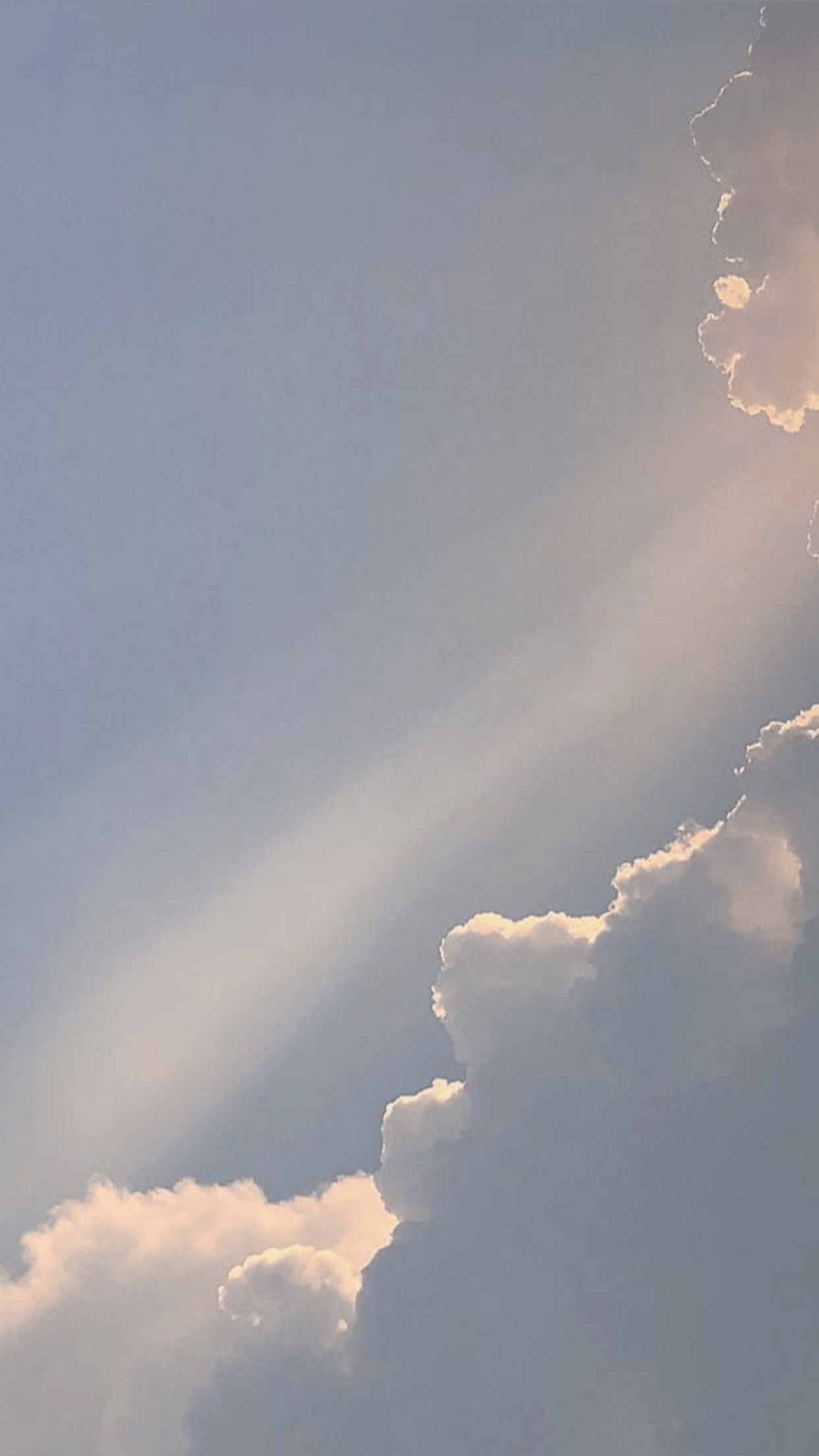A plane flying through the clouds with sun shining - Gray, sunlight