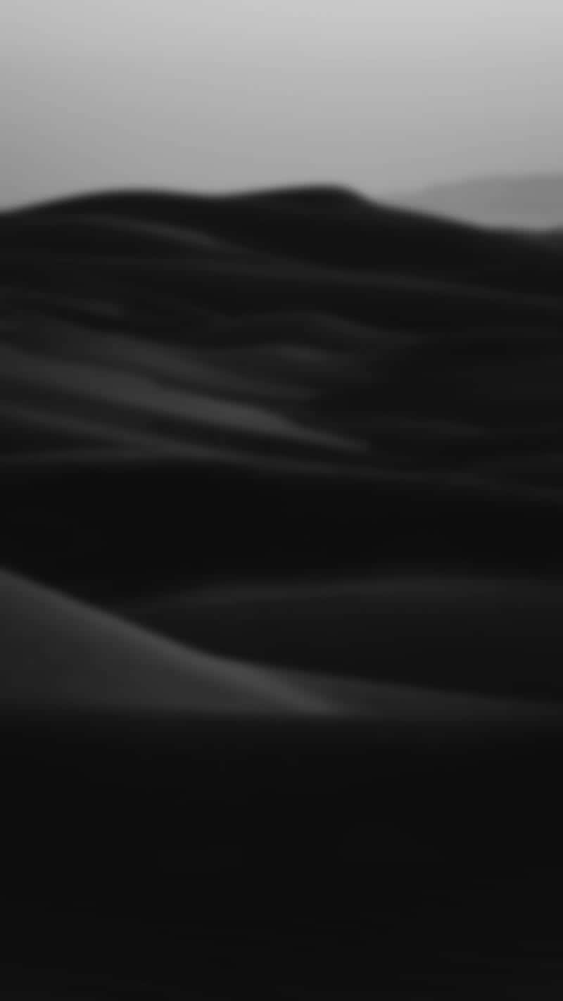 A black and white photo of sand dunes - Modern, dark, blurry