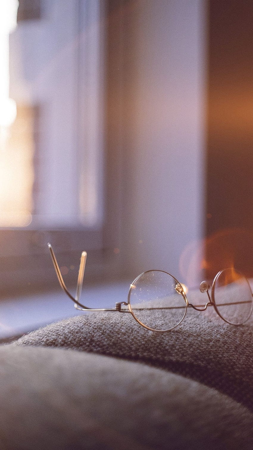 A pair of glasses sitting on top - Sunlight