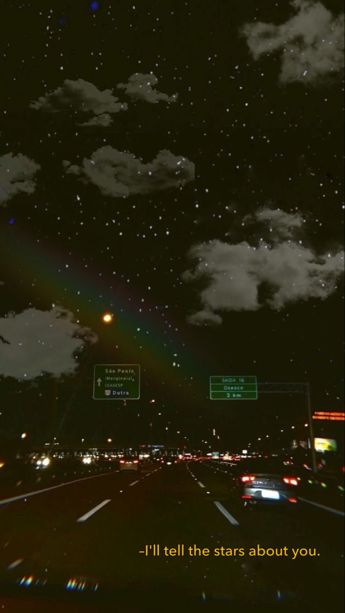 A rainbow over the highway at night - Night
