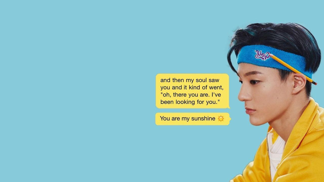 A person wearing a yellow jacket and a blue headband - NCT