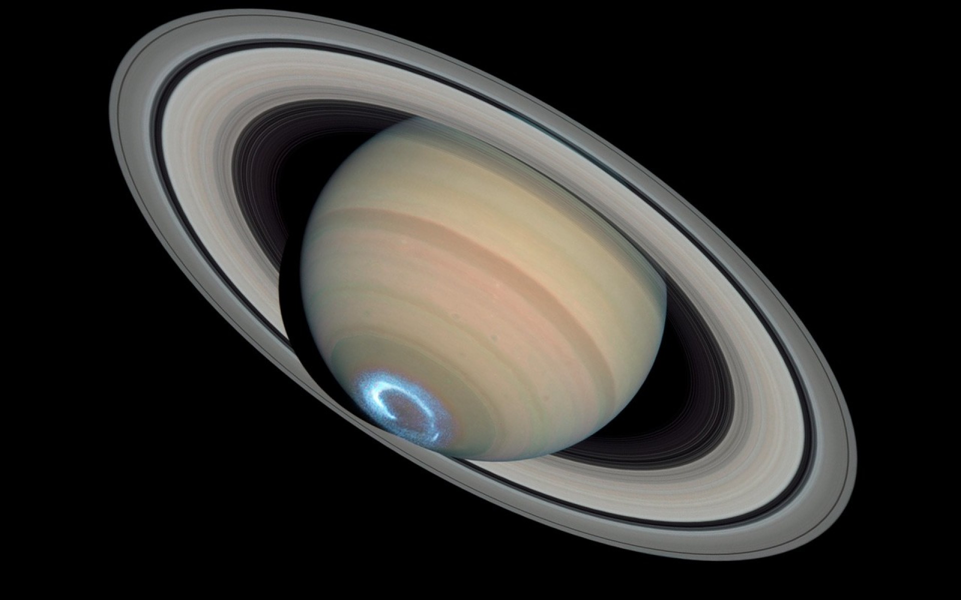 Saturn's north pole, with a giant storm churning in its atmosphere. - Saturn