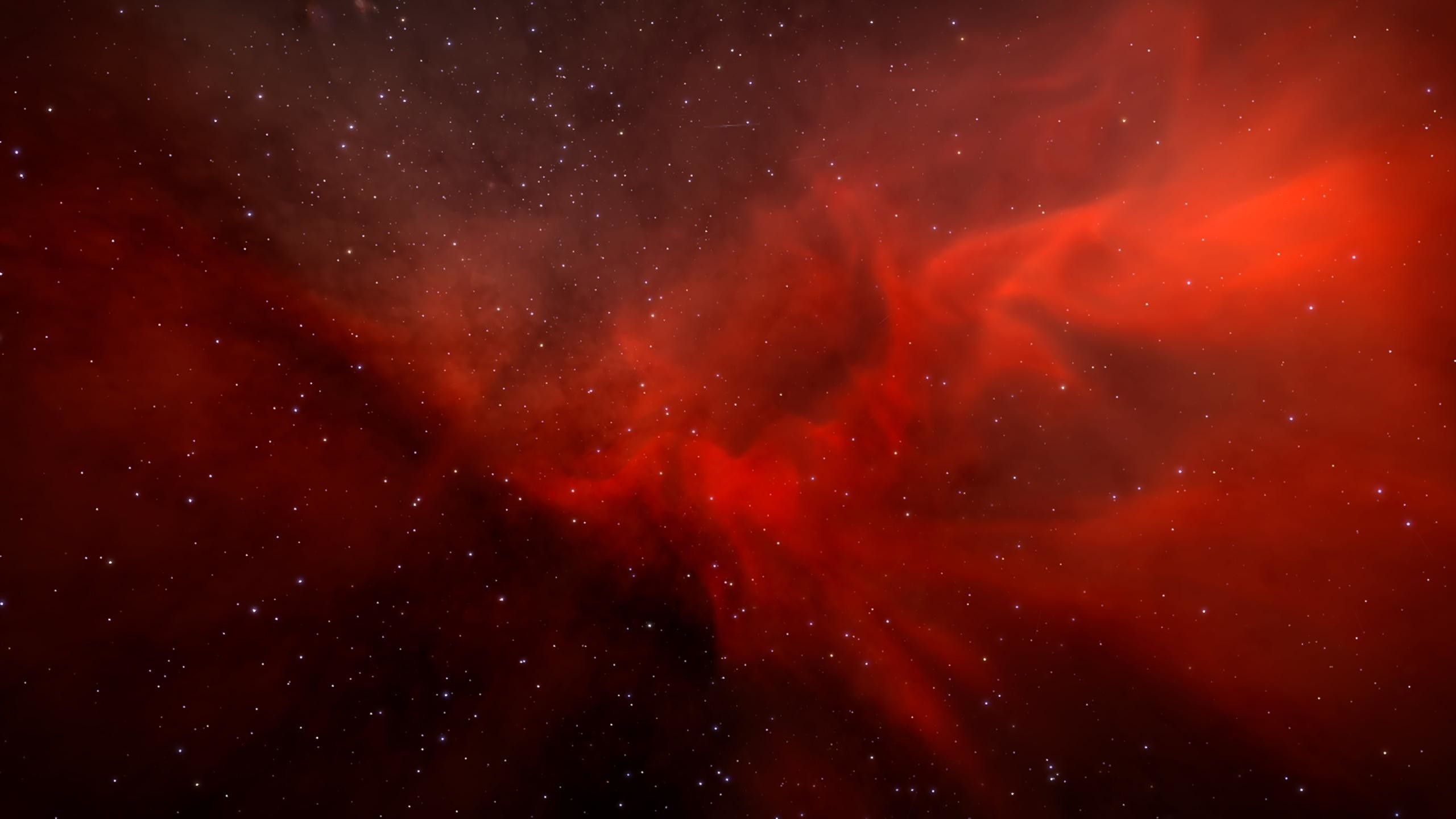 A deep space image with a red nebula and stars - 2560x1440
