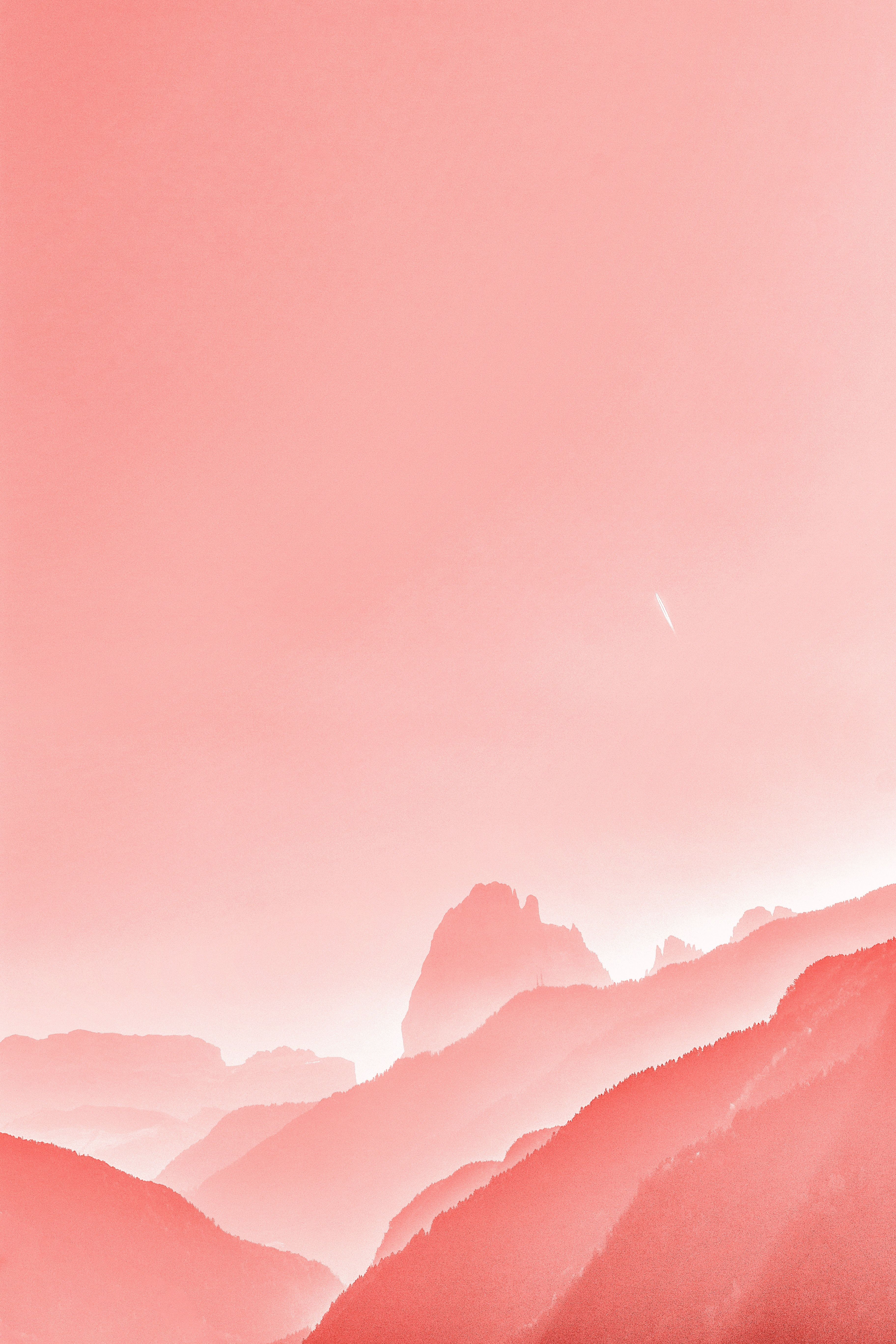 A pink sky with mountains in the background - Pastel