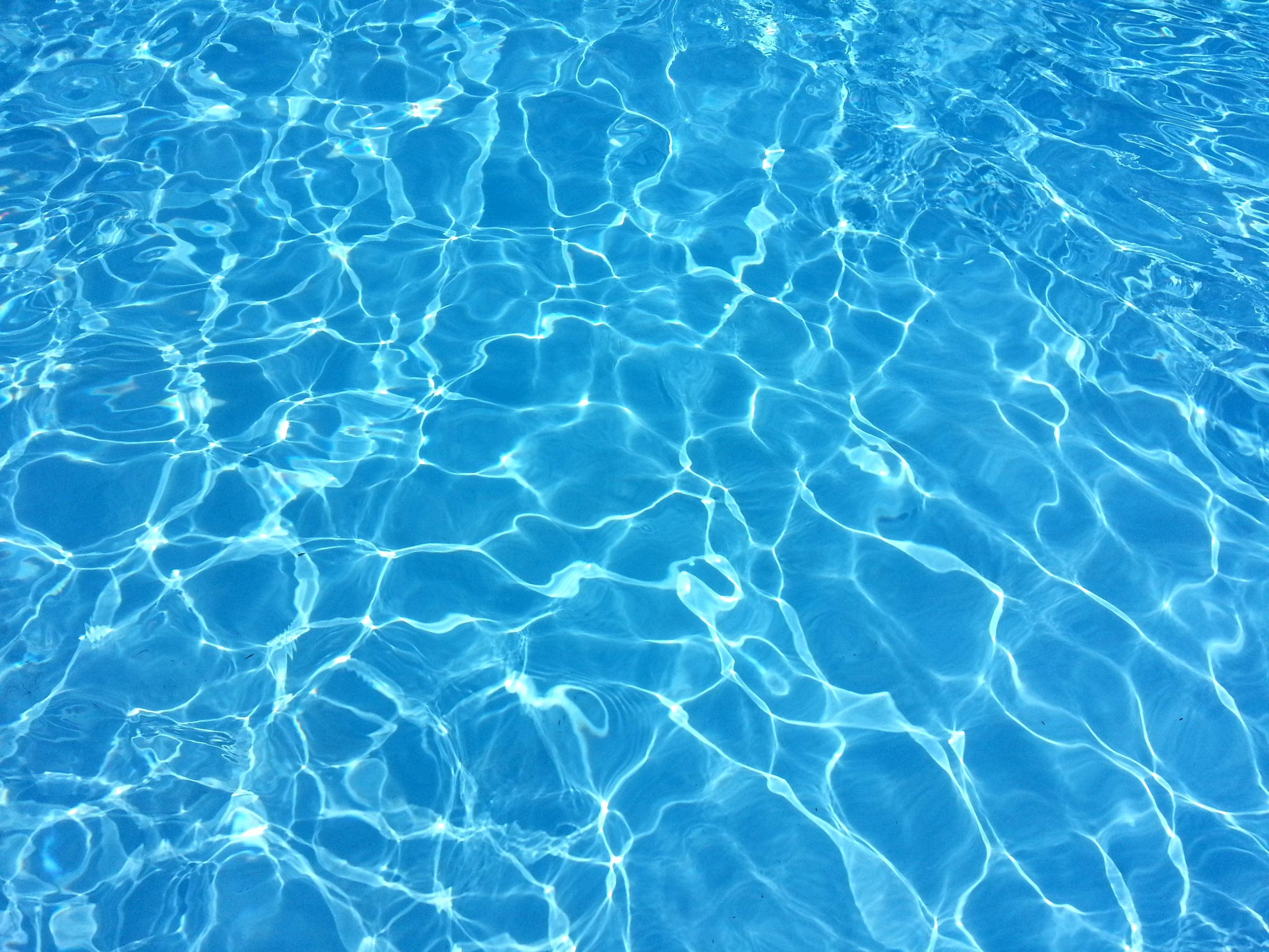 Blue water in a swimming pool with ripples - Swimming pool