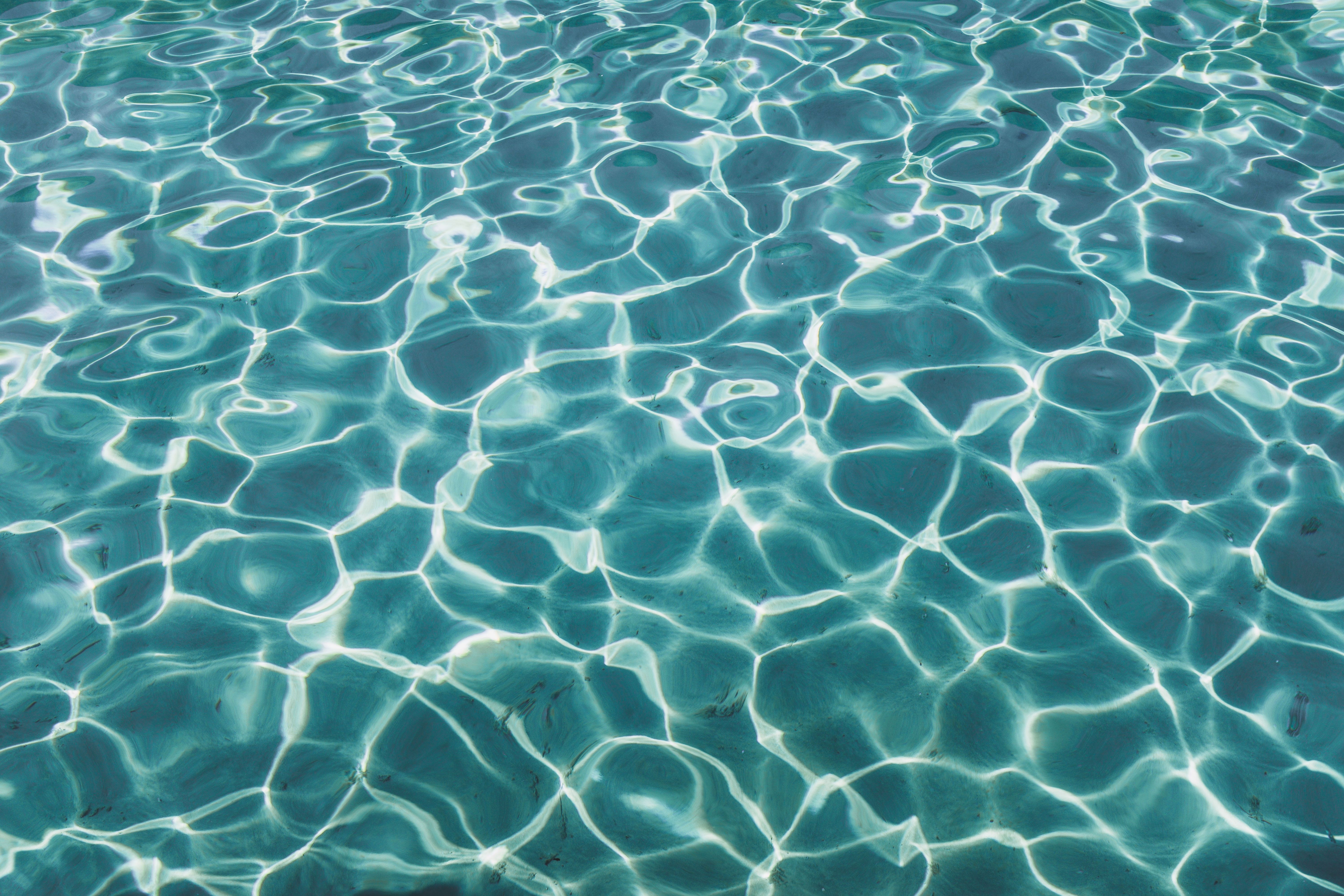 A close up of the water in an outdoor pool - Swimming pool