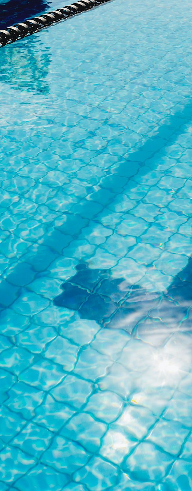 A man is swimming in the pool - Swimming pool