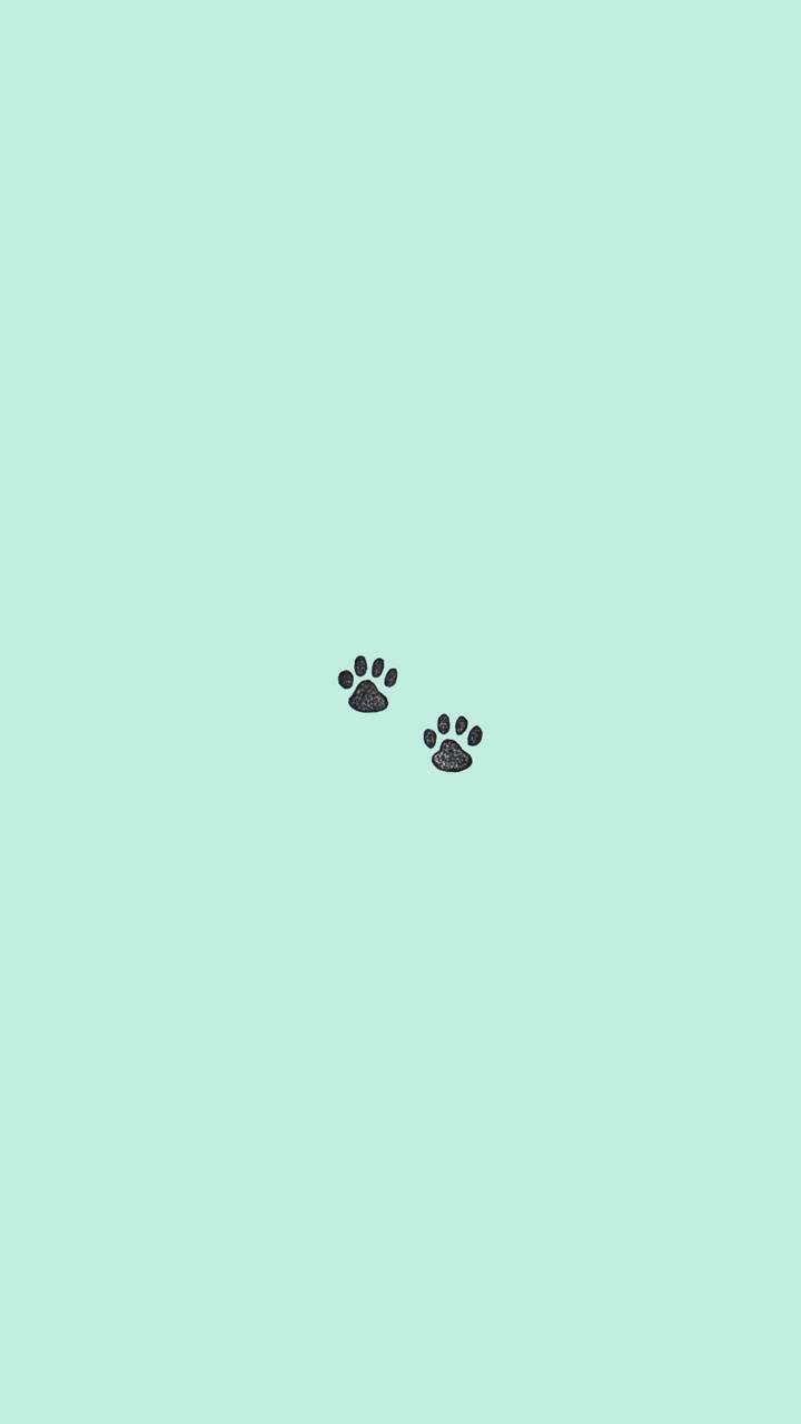 IPhone wallpaper with two paw prints on a blue background - Puppy