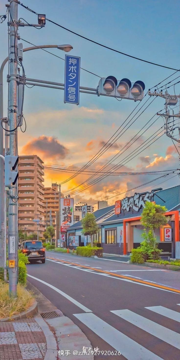 Aesthetic Japanese city street with a sunset in the background - Scenery