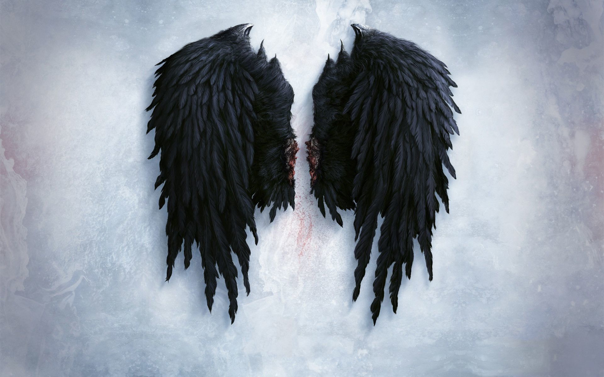 A black angel with wings on the ground - Wings