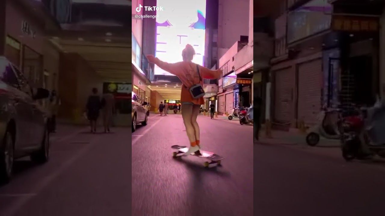 A person riding on top of skateboard down the street - Skater