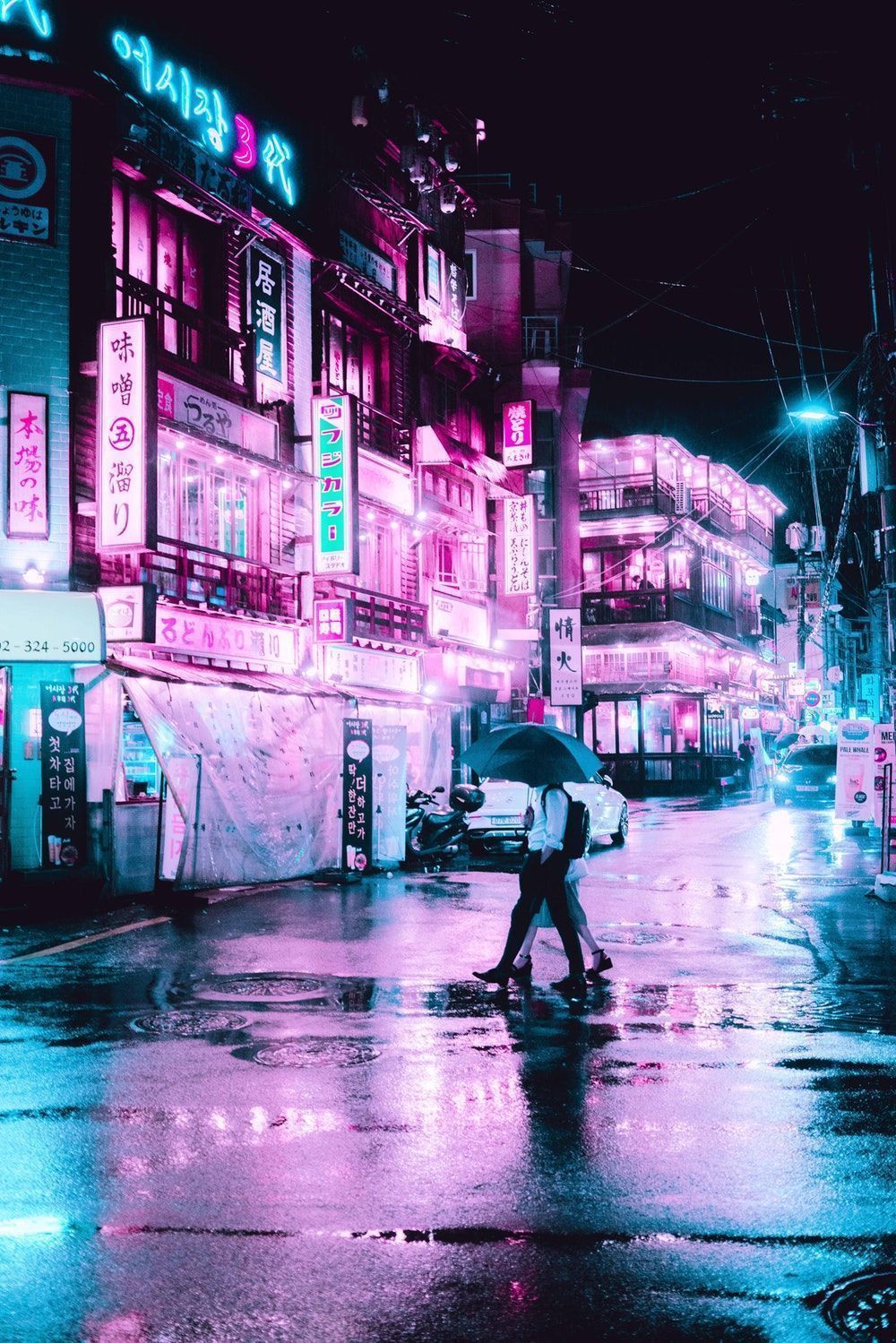 A person walking down the street with an umbrella - Seoul, neon pink