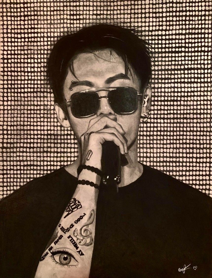 A black and white drawing of a man with sunglasses holding a microphone. - Jungkook