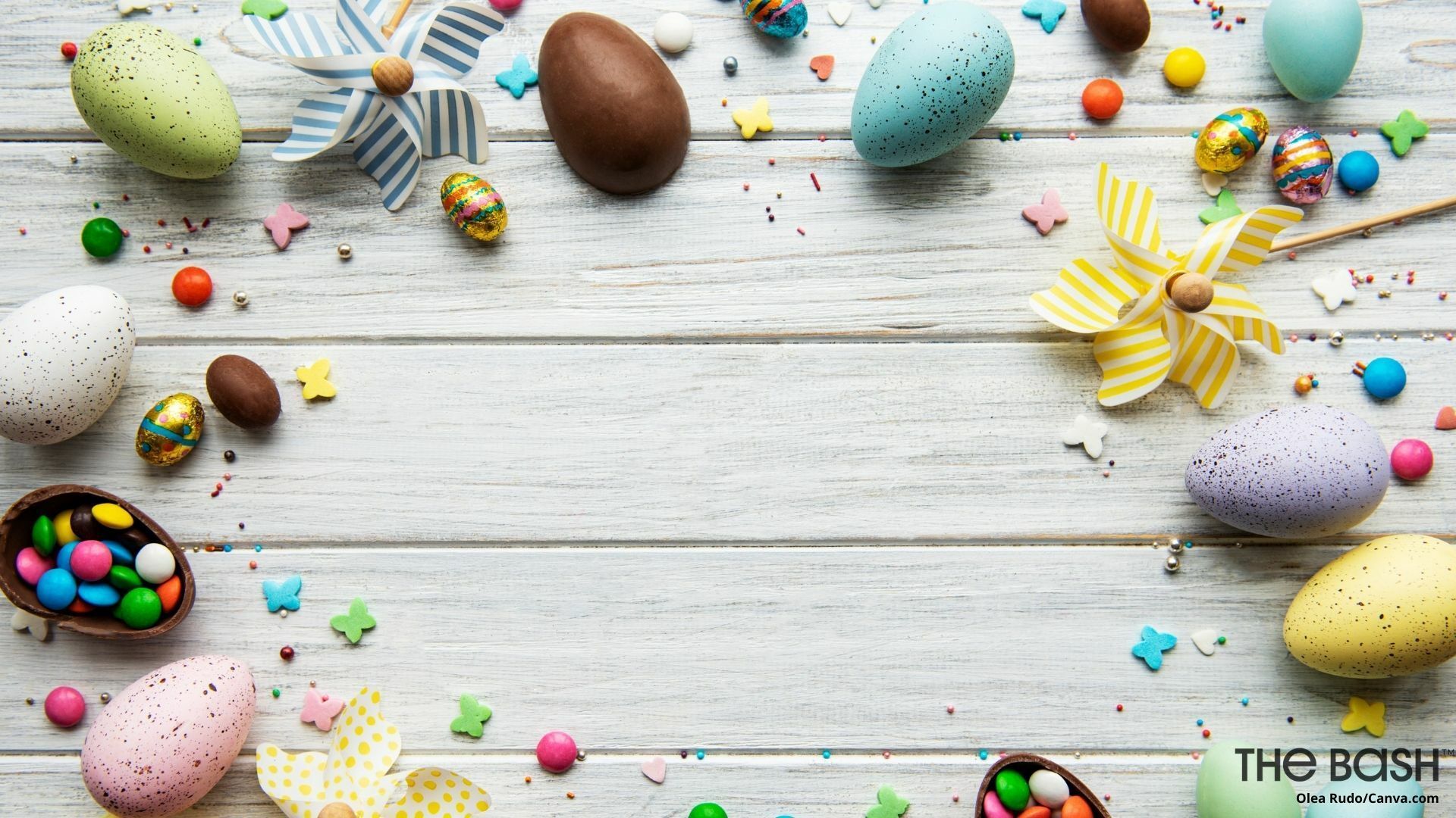 Easter eggs and candy on a white wooden table - Easter
