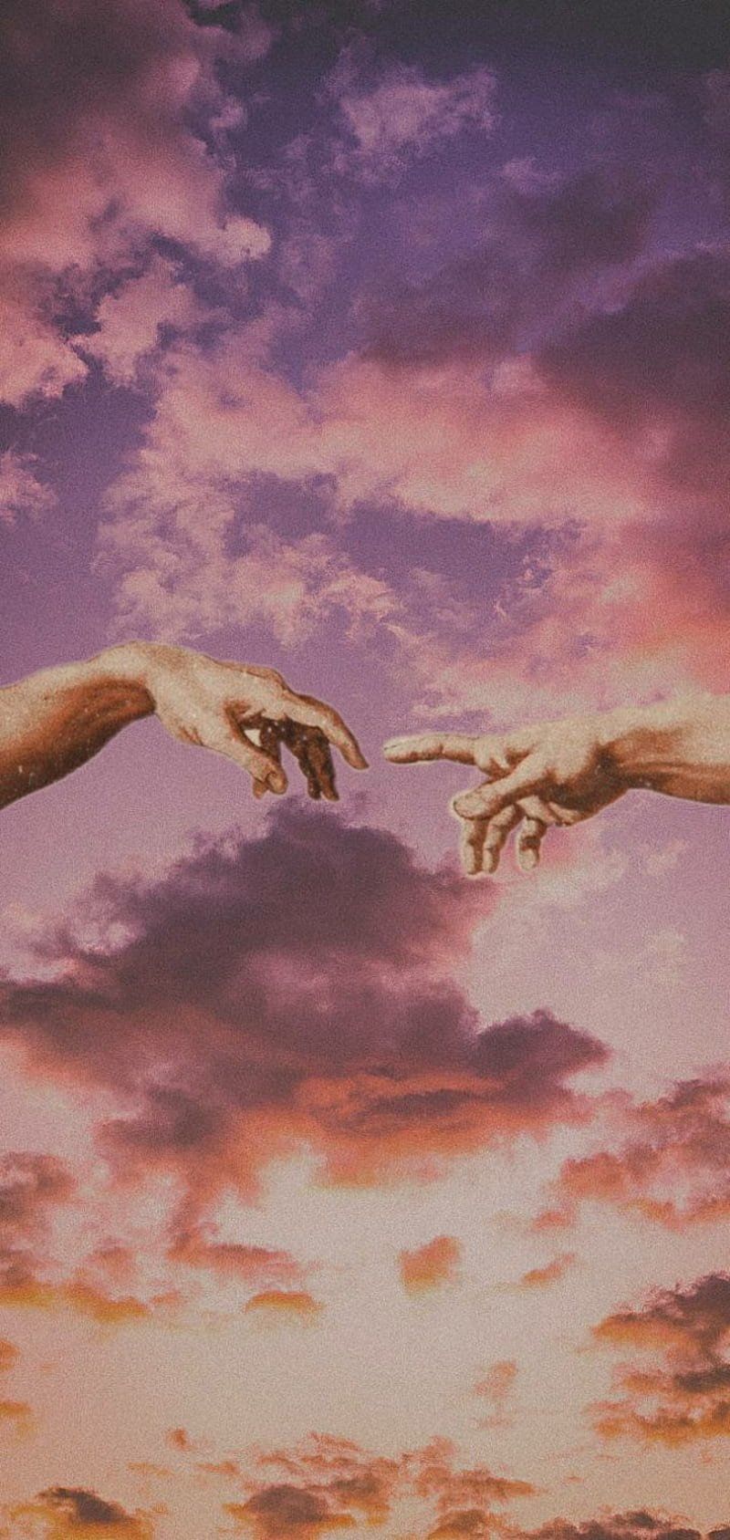 Two hands reaching for each other in front of a sunset - Angelcore