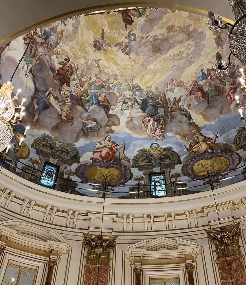 A large circular painting on the ceiling of an old church - Angelcore