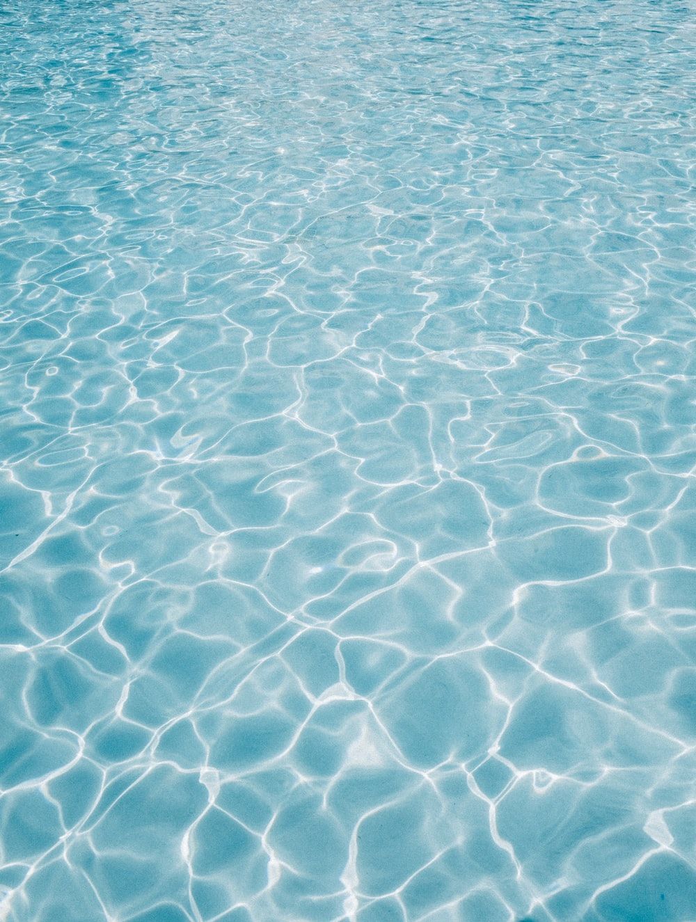 A close up of the water in an outdoor pool - Swimming pool