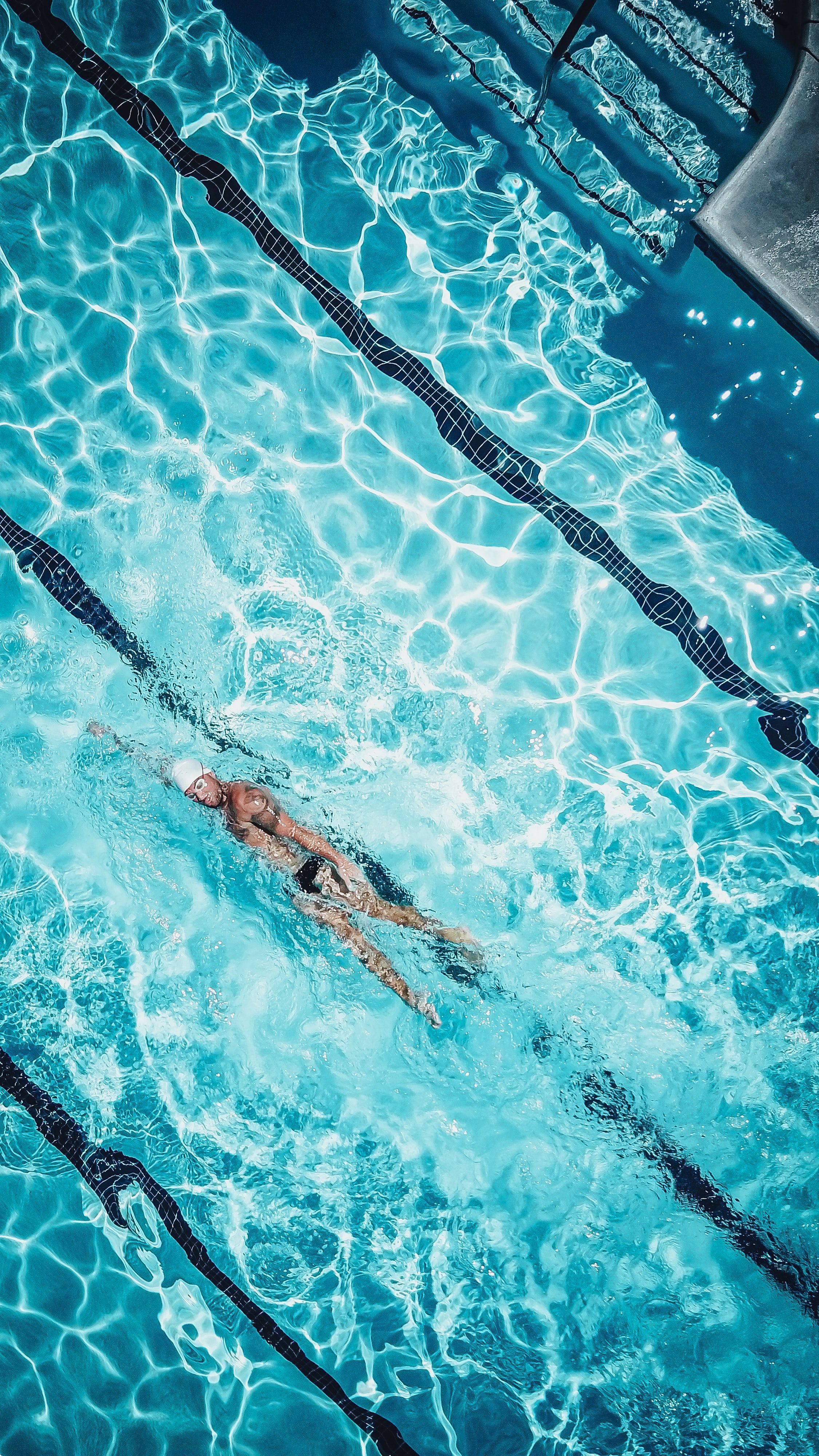 A Person Swimming in the Pool · Free