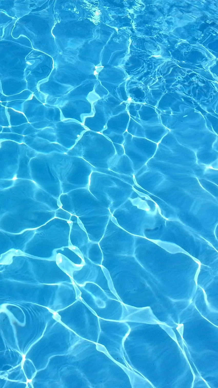 A close up of the water in a swimming pool. - Swimming pool, water