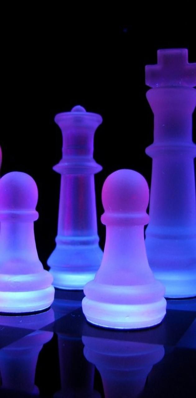 A set of glowing chess pieces on black and white background - Chess