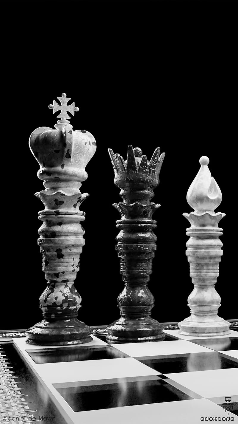 A black and white photo of three chess pieces on a chess board - Chess