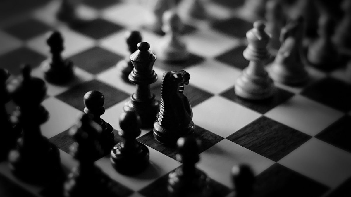 Black and white chess pieces on a chess board - Chess