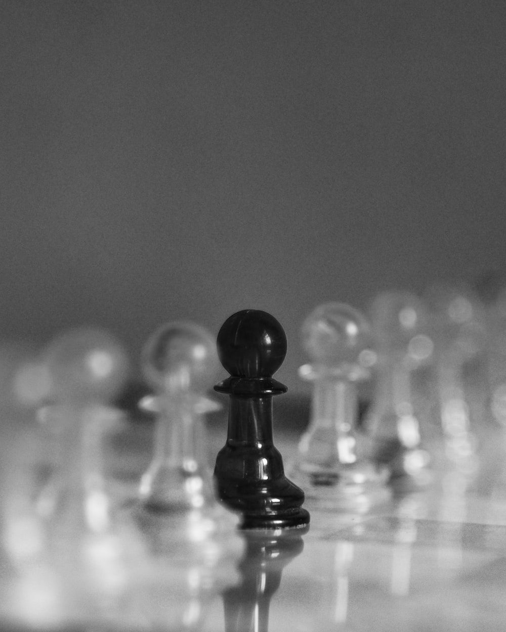 a black and white photo of a chess board photo