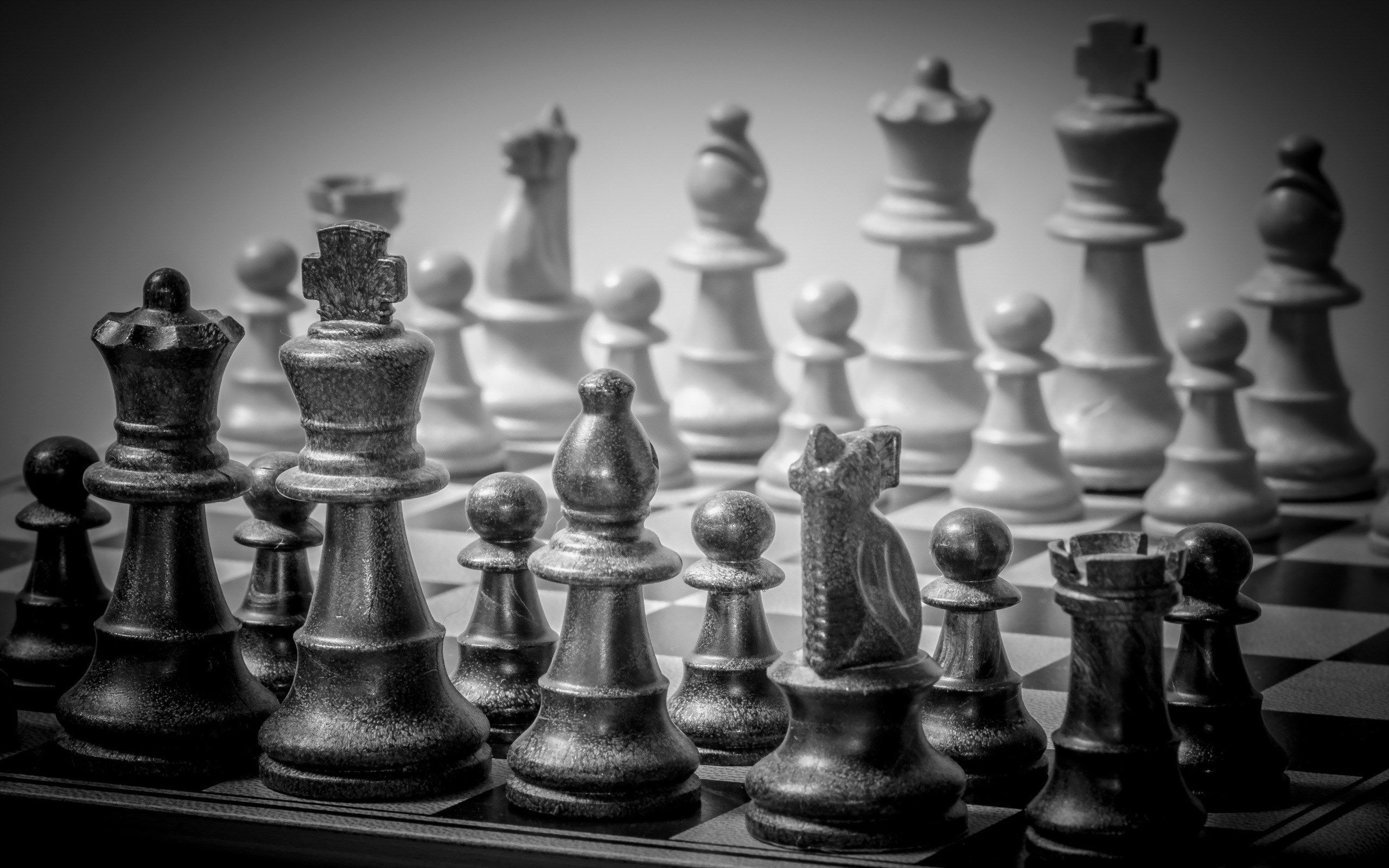 A black and white photo of a chess board - Chess