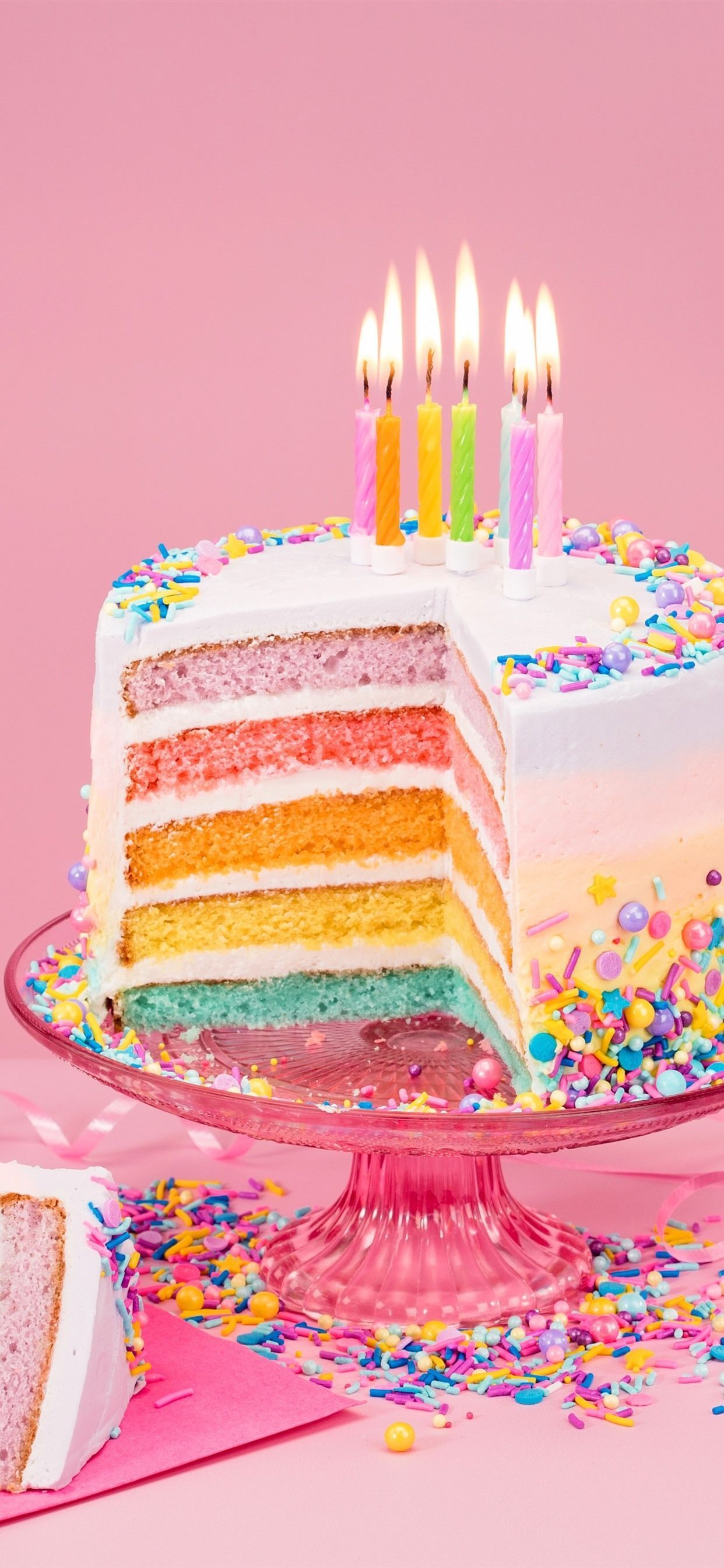 A cake with candles and confetti on top - Cake