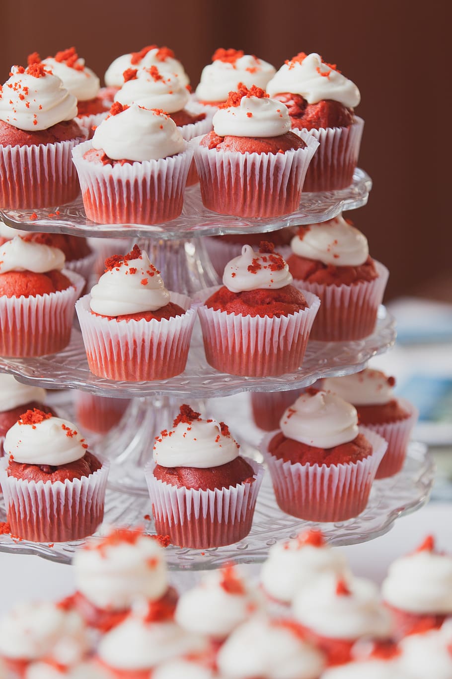A tray of cupcakes with white frosting and red sprinkles - Cake, cupcakes