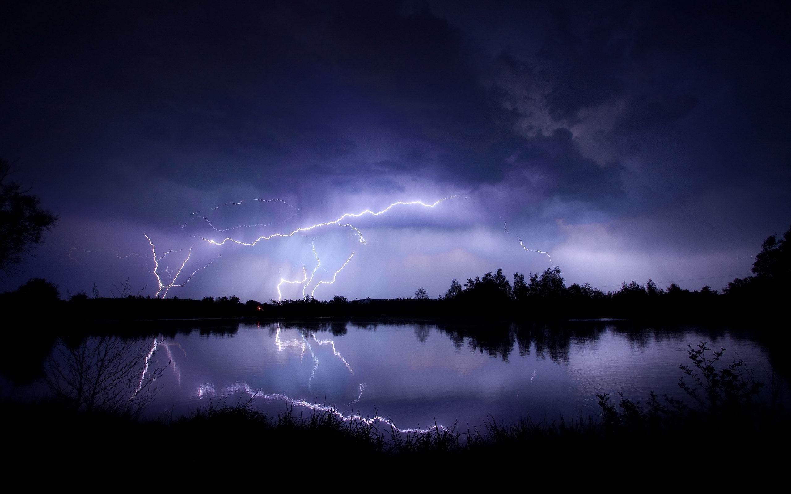 Lightning storm over a lake - Storm