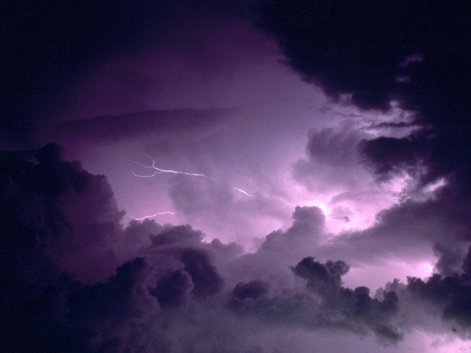 A stormy sky with purple lighting - Storm