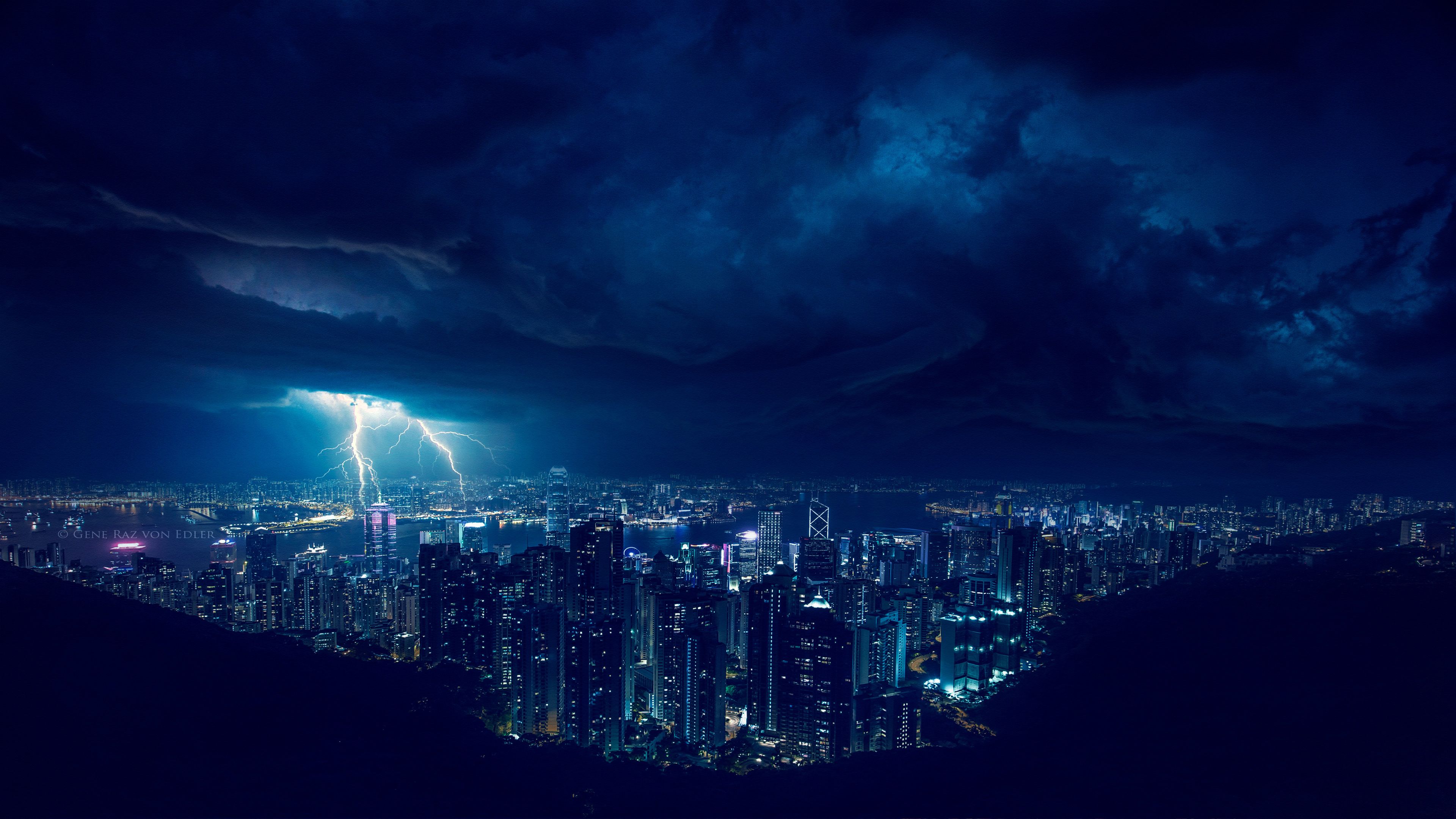 A city at night with lightning in the sky - Storm