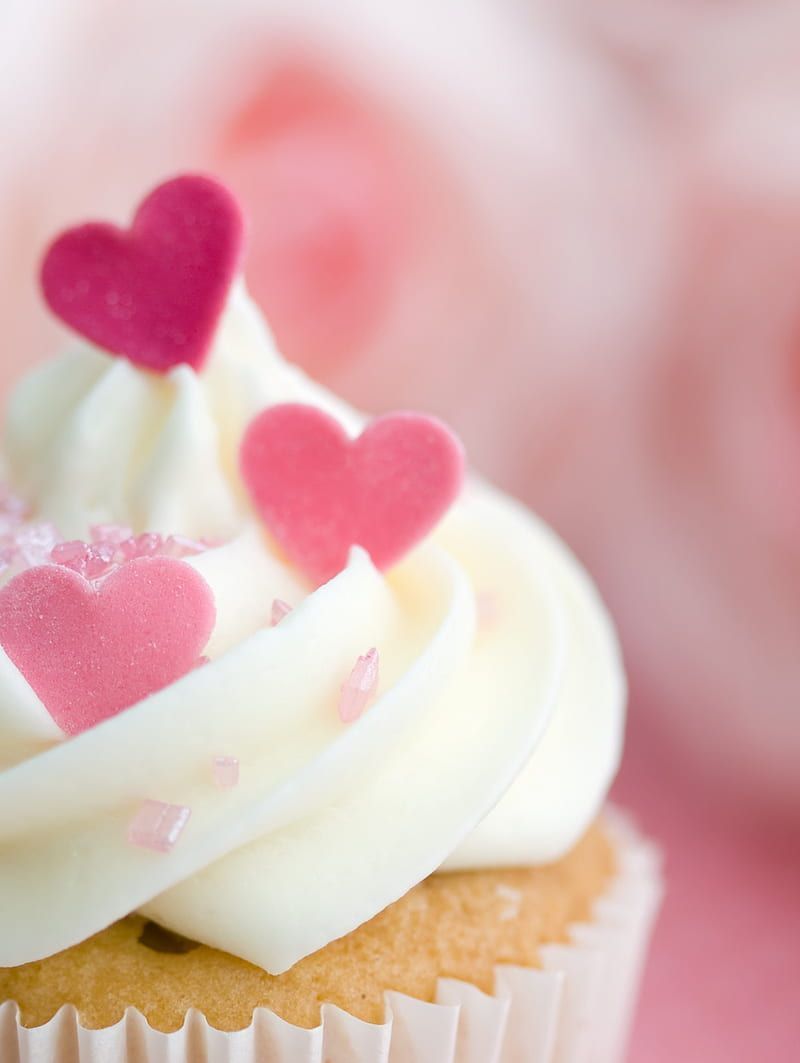 A cupcake with white frosting and pink hearts - Cupcakes, cake