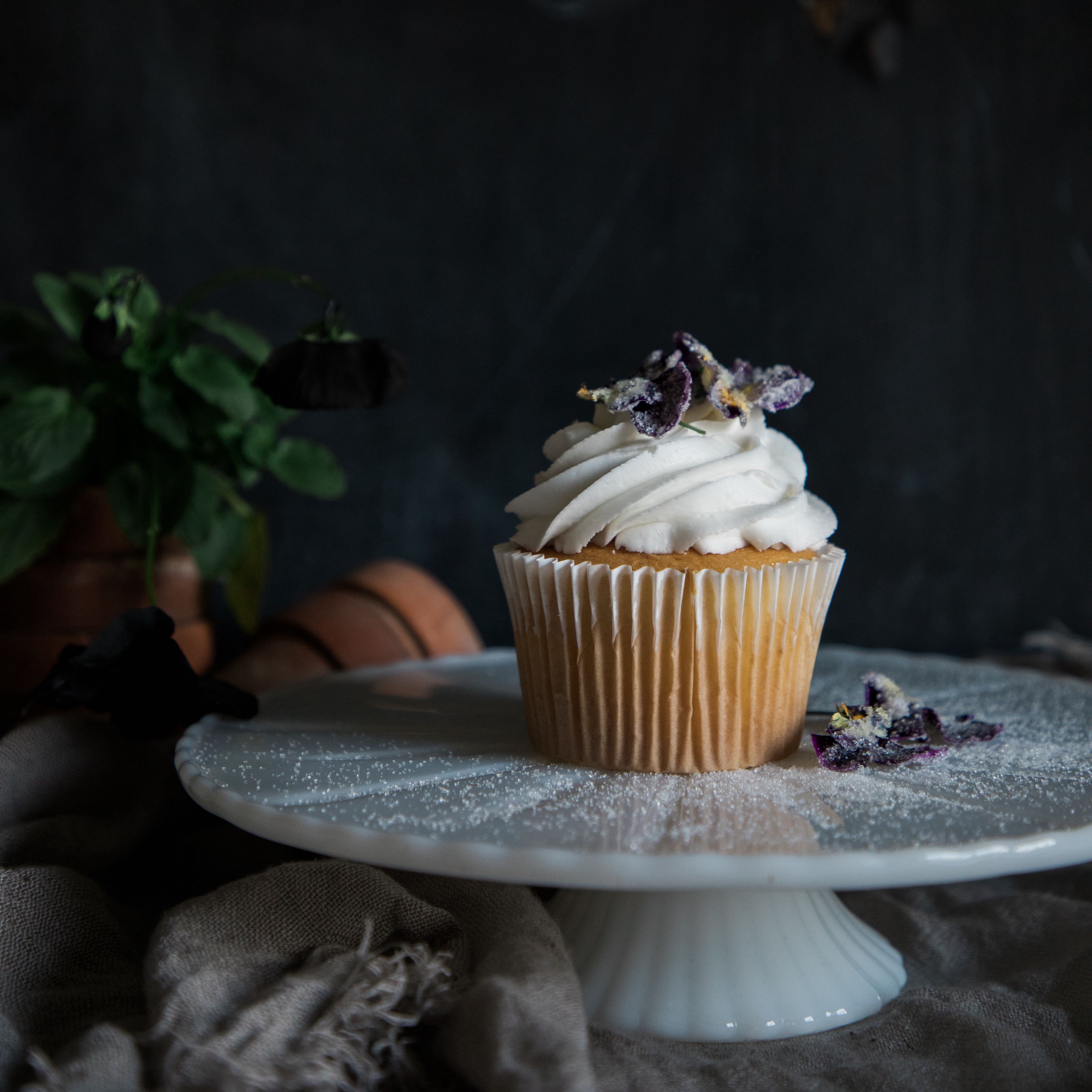 A cupcake with frosting and flowers on top - Cake, cupcakes