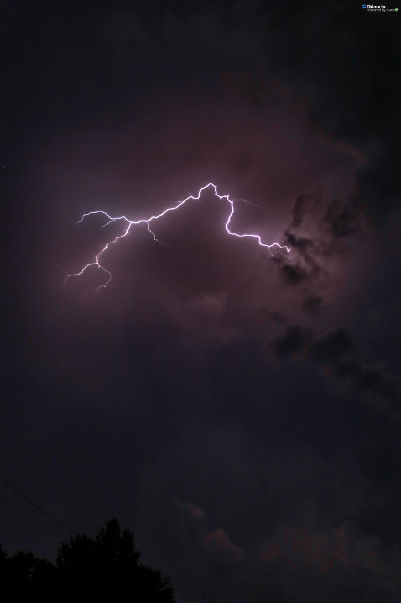 A lightning bolt is seen in the sky - Storm