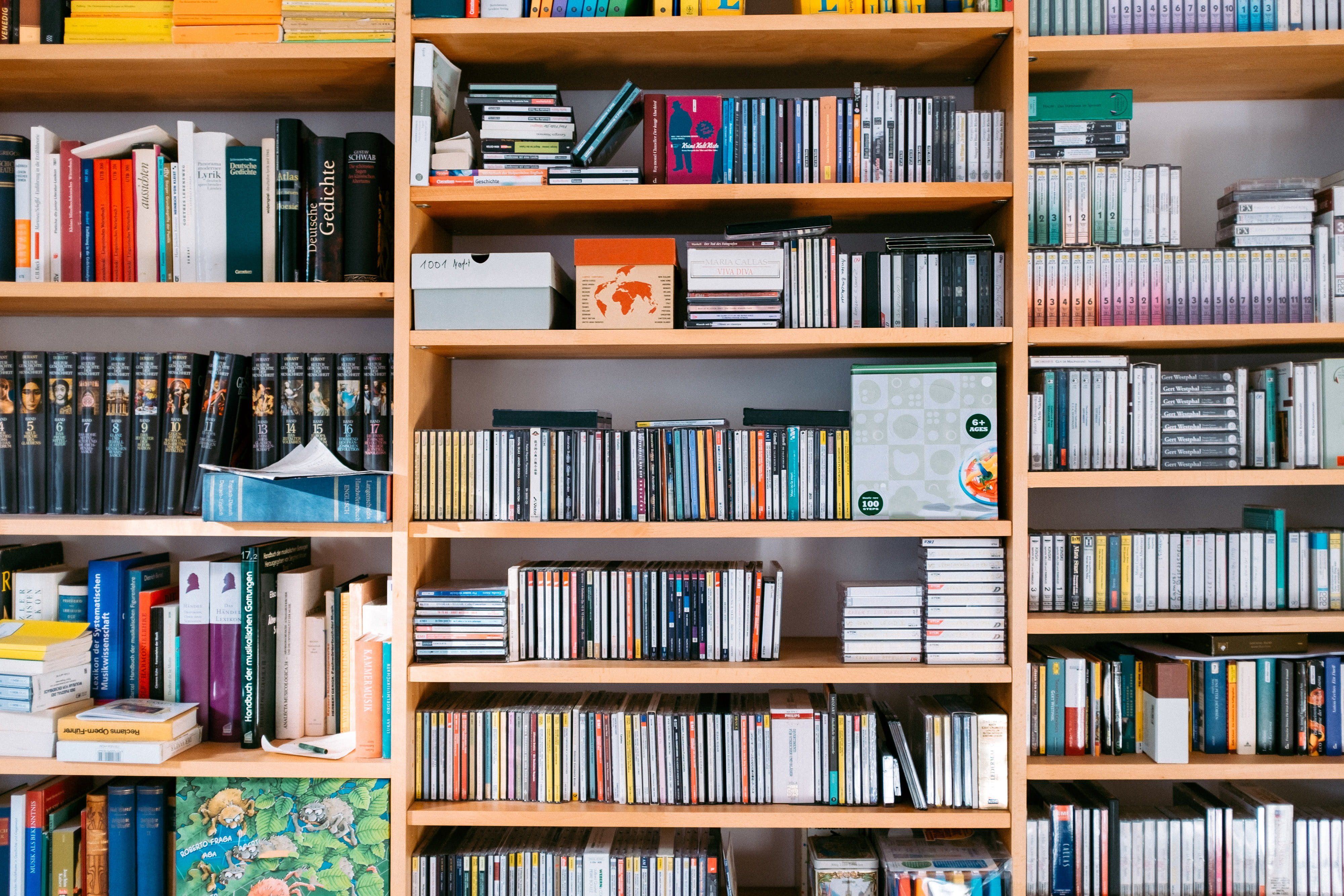 A bookshelf full of books, with many books on display. - Bookshelf