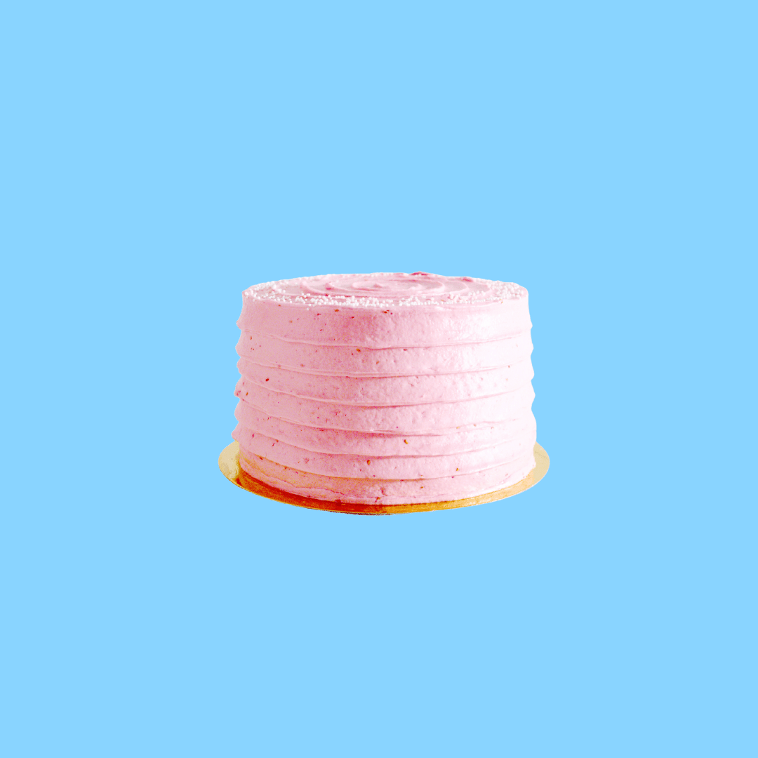 A pink cake on top of an orange plate - Cake