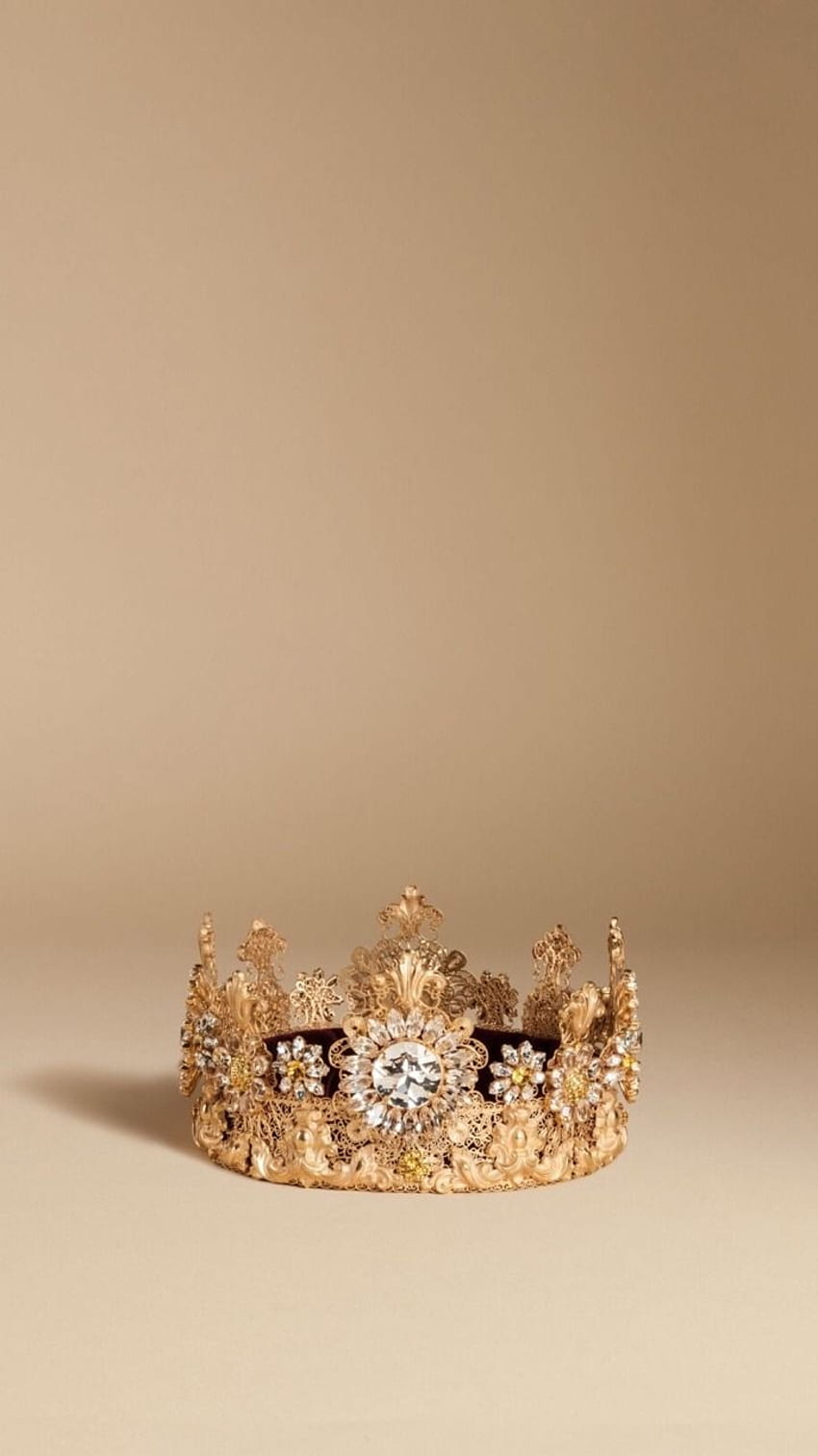A gold crown with jewels on it - Crown