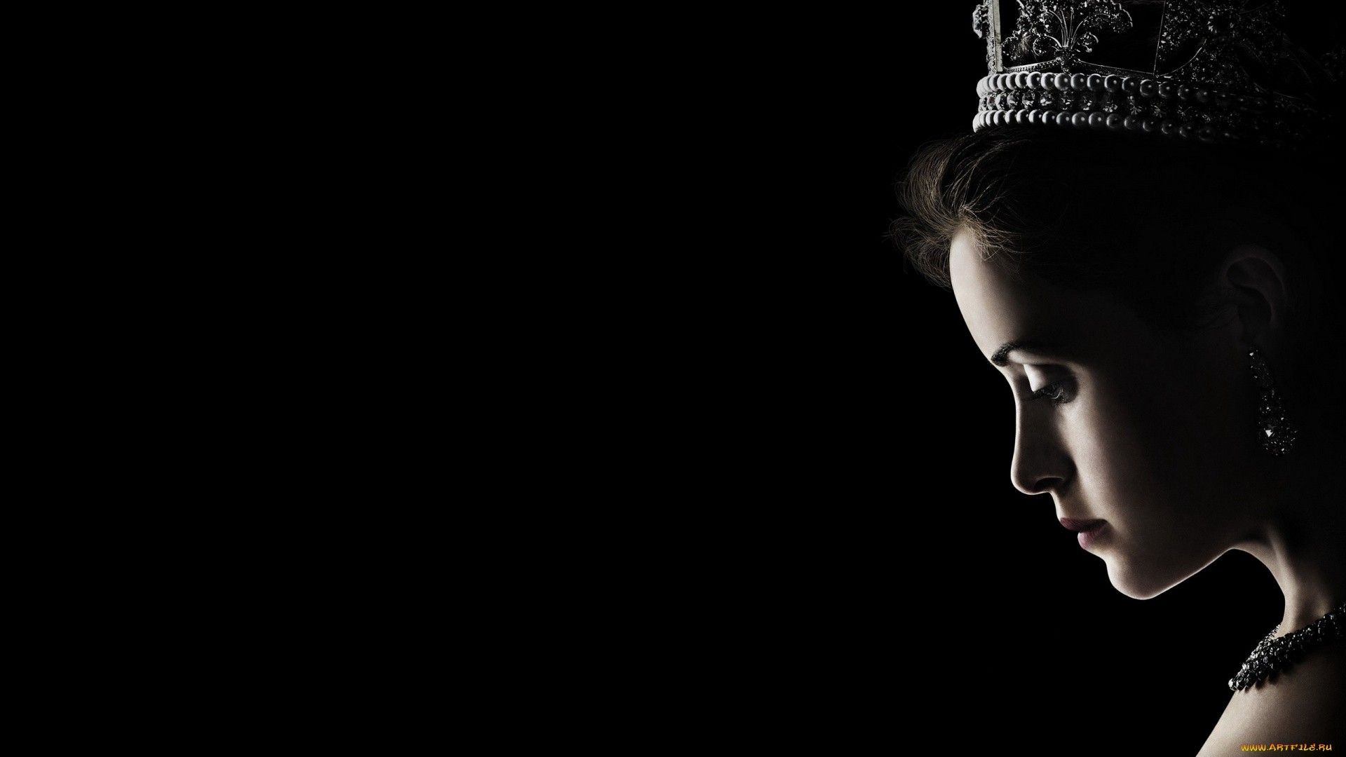 A black and white image of a woman wearing a tiara, looking down. - Crown