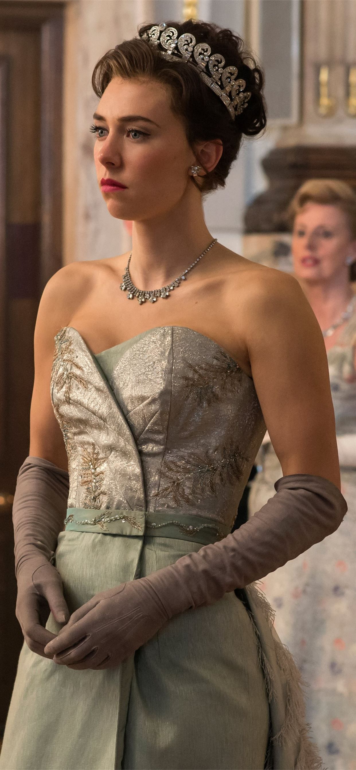 Princess Margaret wears a pale green dress with a silver bodice and gloves in The Crown - Crown