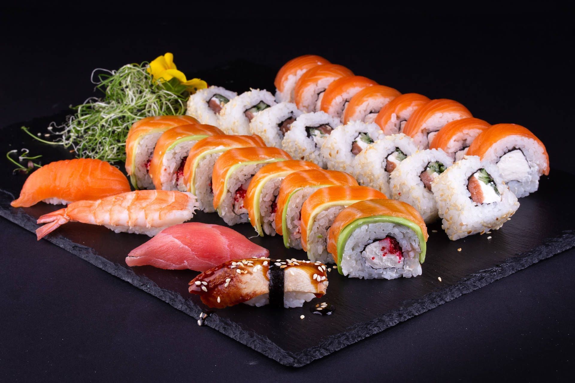 A sushi platter with various types of fish - Sushi