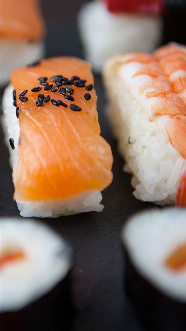 A close up of some sushi on top - Sushi