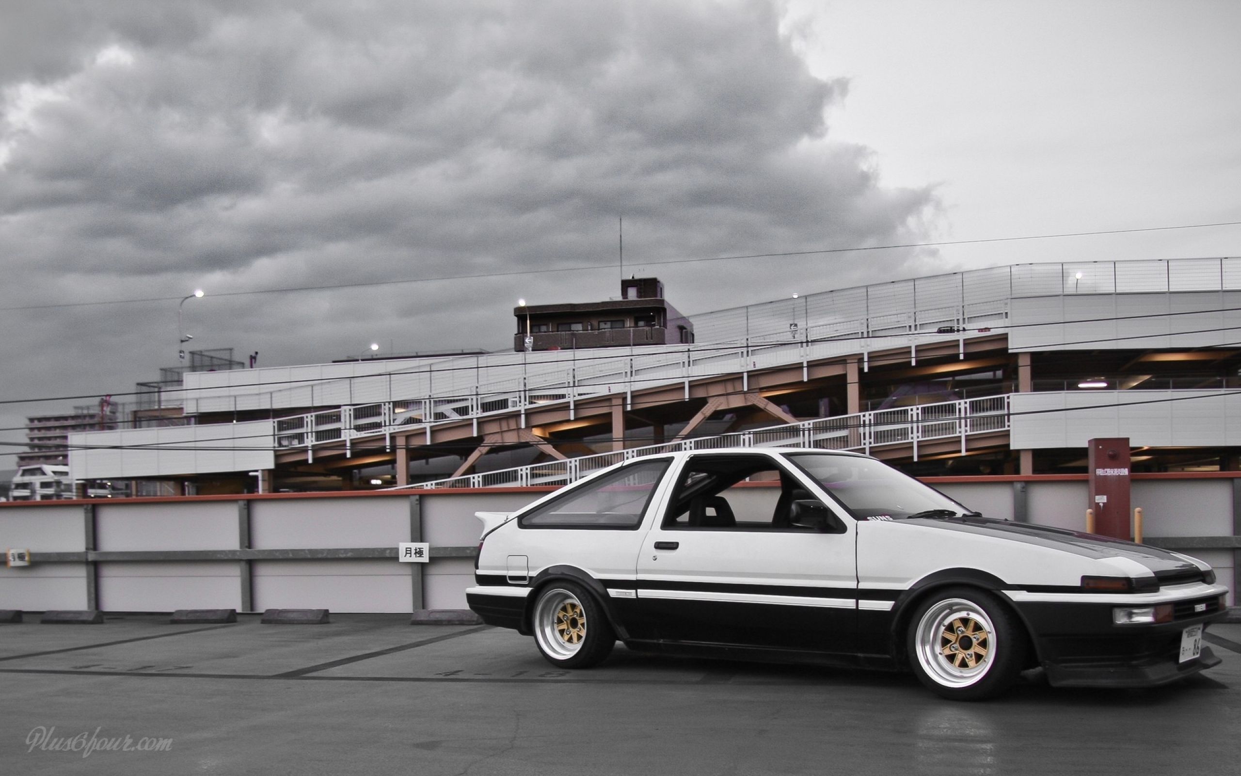 A car parked on the side of an overpass - Toyota AE86