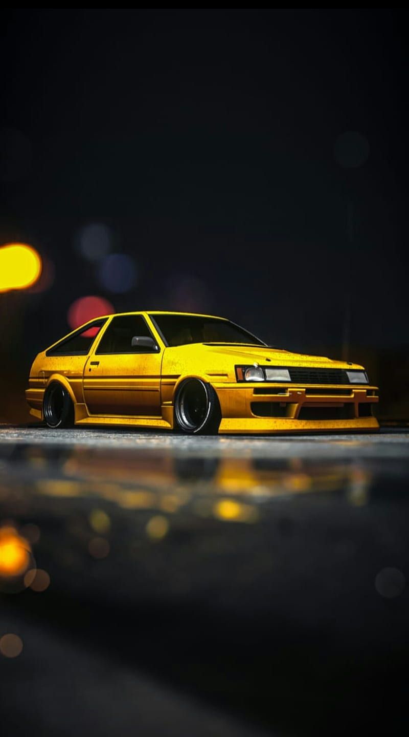 A yellow car is parked on the street - Toyota AE86
