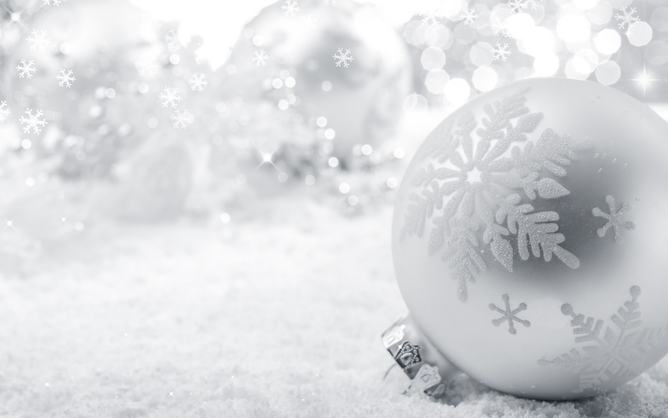 Christmas wallpaper with a silver bauble on the snow - White Christmas