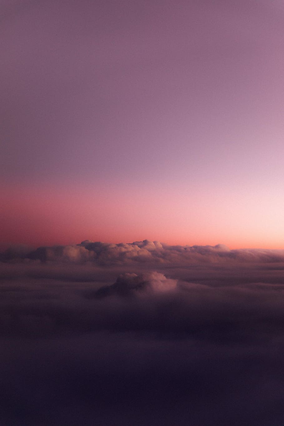 A purple and pink sky with clouds - 